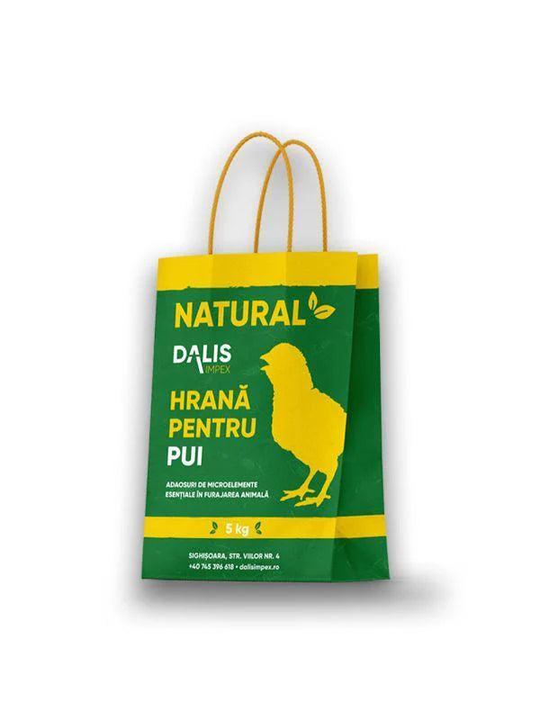 Green and yellow packaging bag for 5 kg natural chicken feed by Dalis Impex with chick silhouette