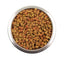 Metal bowl filled with multi-colored star-shaped dry pet food kibbles