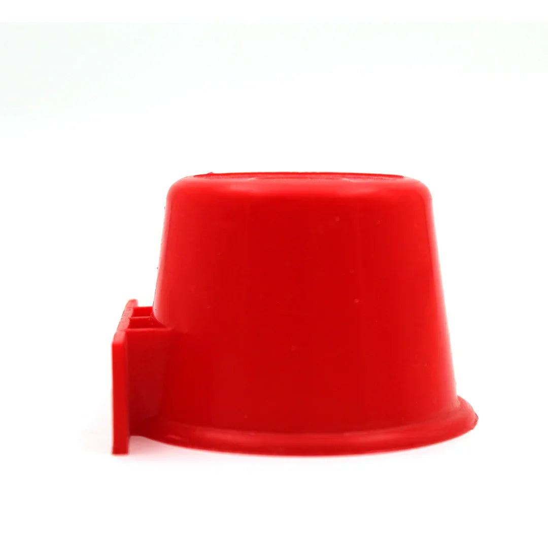 Red plastic pigeon waterer feeder cup isolated on white background