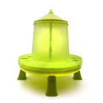 Green plastic poultry feeder with circular base and conical lid for bird feed