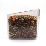 Clear plastic container filled with colorful birdseed mix including seeds and pellets