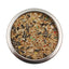 Metal bowl filled with assorted bird seeds including sunflower seeds and millet for pet birds