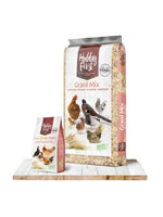 Hobby First Grani Mix and Grani Mix Pellet bags for poultry feed with chicken and bird images on wooden surface