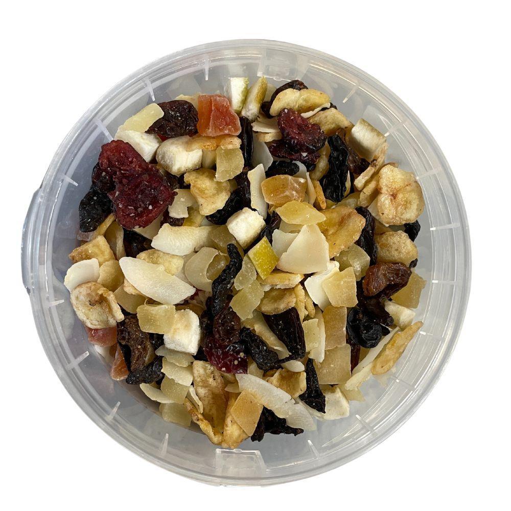 Clear plastic container filled with mixed dried tropical fruits including banana, pineapple, coconut, and papaya pieces