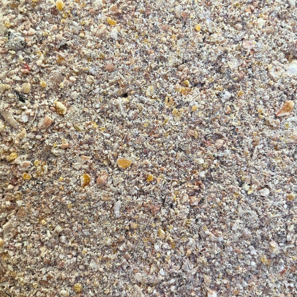 close-up of mixed granular poultry feed with grains and meal for laying hens