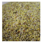 Close-up of yellow and mixed grains bird feed for pigeons with seeds and pellets