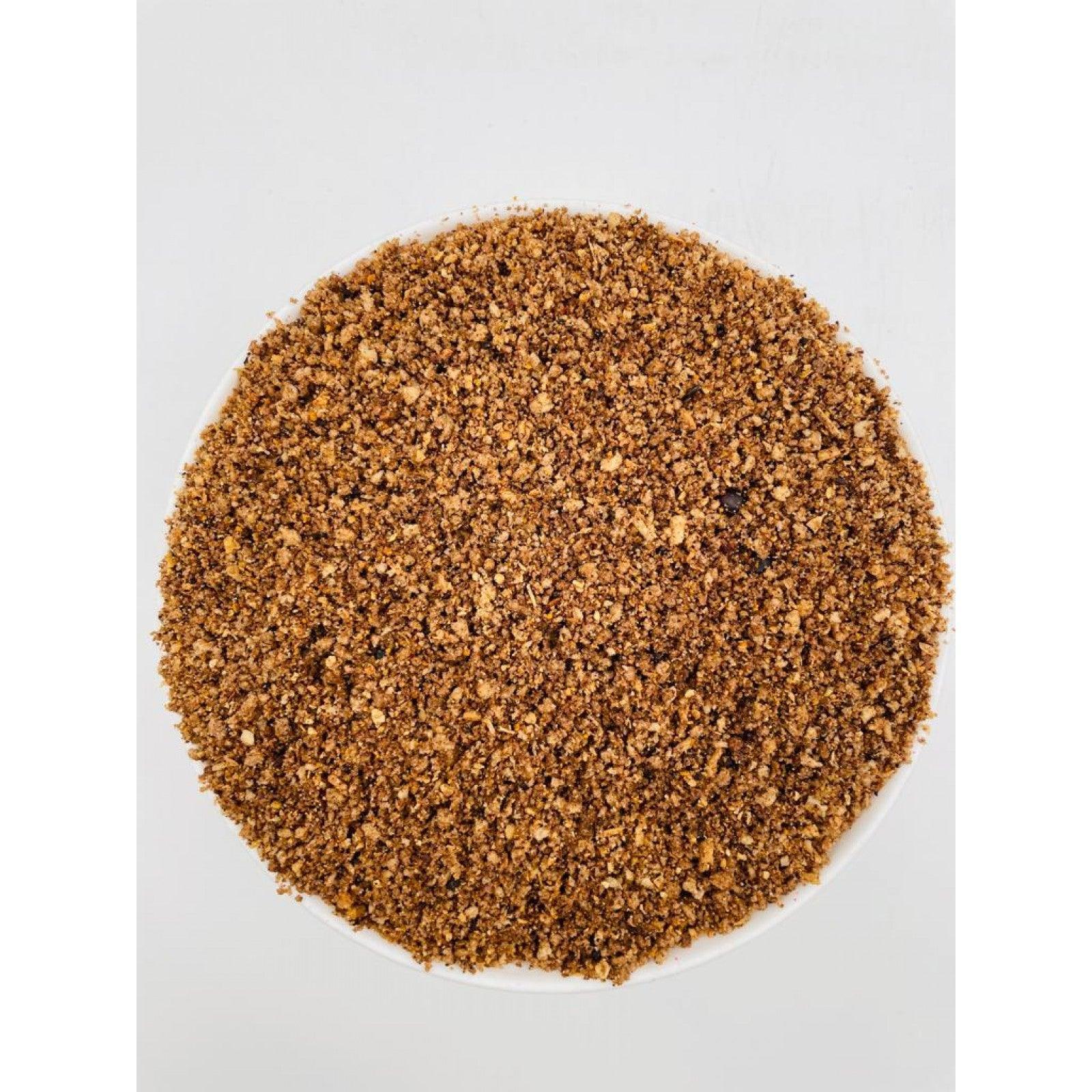 Close-up of 10 kg coarse universal pâté pet food in a white bowl on white background