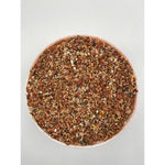 Close-up of mixed mineral and seed blend in a round bowl on white background