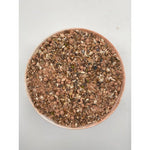 Top view of a bowl filled with mineral paloma multi power mix feed with seeds and pellets