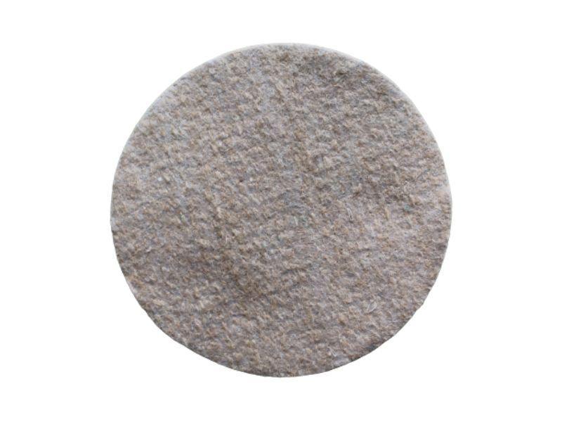 Round gray felt pad for nesting box insulation isolated on white background