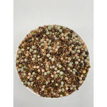 Top view of a white bowl filled with a colorful mix of various dried protein-rich seeds and legumes