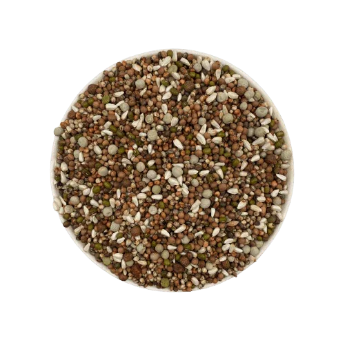 top view of mixed pet food pellets and seeds in a round container on light background