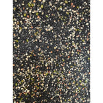 Close-up of mixed sprouting seeds including black, green, and beige seeds with small sprout shoots